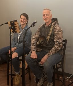 Kellyn's husband ready to perform at a Paint Night.