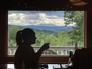 A glass of wine, great company, and a gorgeous view