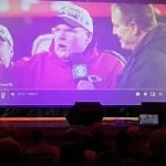 Kansas City Chiefs coach, Andy Reid on the "big screen"