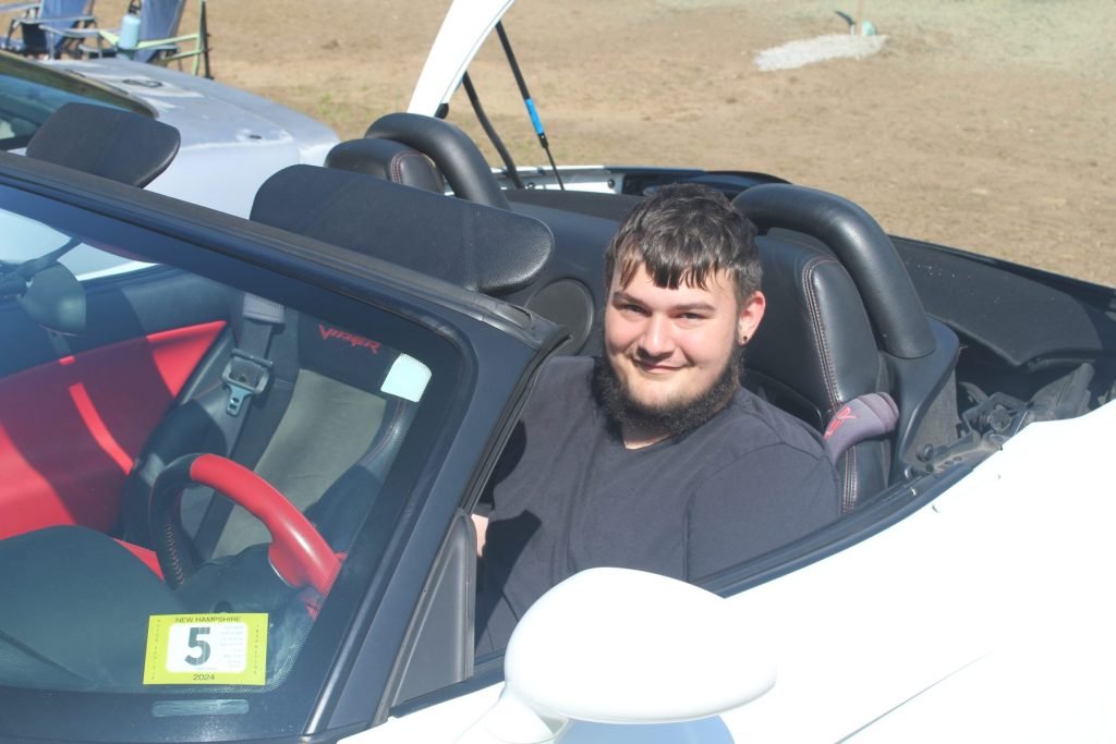 Jacob sitting in the 2004 Dodge Viper
