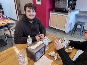 Jacob with his burrito at Tito's in Keene