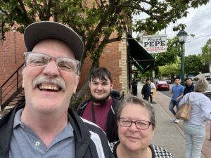 Tina, Lee, and Jacob in front of Pepe's Pizza.