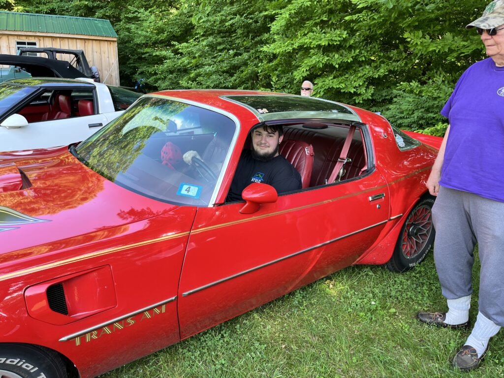 Bob letting Jacob get into his classic T-Top Trans Am.