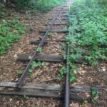 Forgotten tracks, timeless memories – a piece of history from the old railroad, standing still in time.