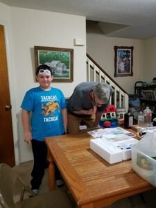 Larry helping Jacob build a volcano